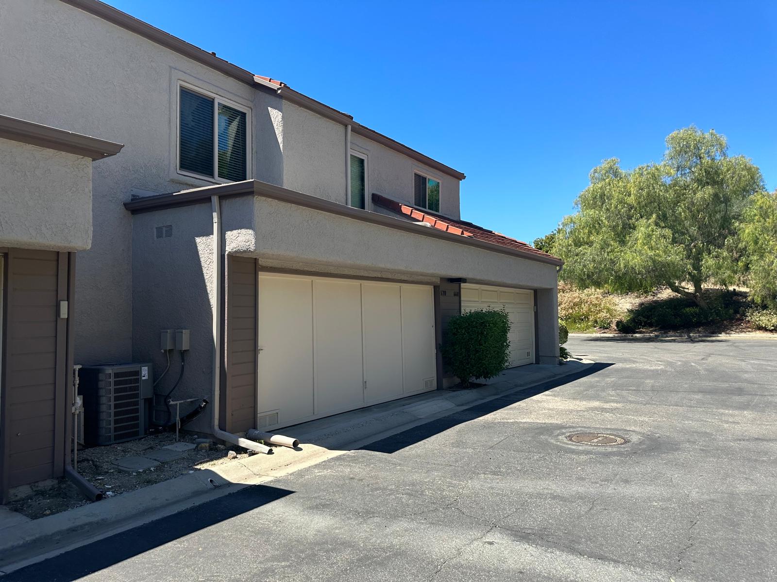 A1 garage door repair technician servicing a garage door in Paramus, NJ
